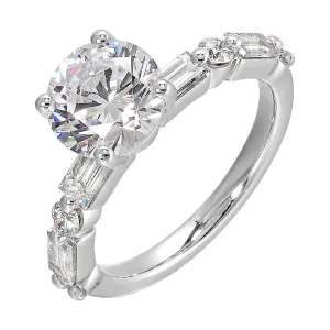 Baguettes and round diamonds spell contemporary elegance along this solitaire engagement ring.