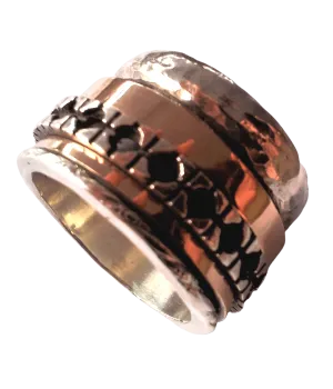 Spinner Ring for Woman silver and gold set with garnets or other gemstones.