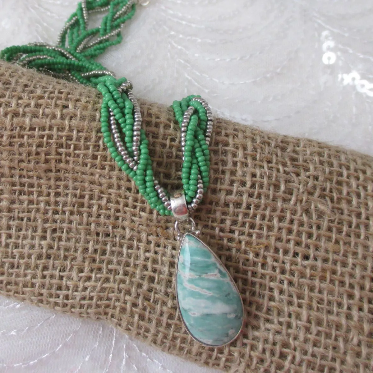 Vasonite Gemstone Pendant on  Green Multi-strand Necklace